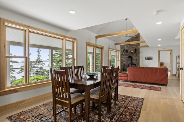 86 City Point Rd, Vinalhaven, ME 04863 - dining area with a wood stove, light wood-style flooring, and recessed lighting
