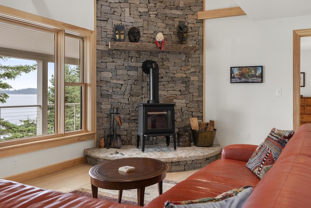 86 City Point Rd, Vinalhaven, ME 04863 - living area with a wood stove and wood finished floors