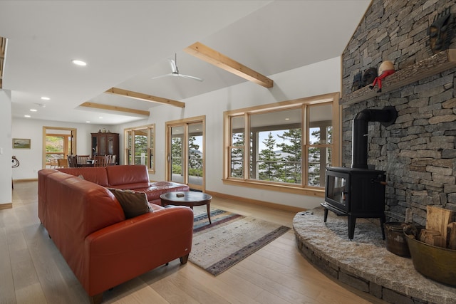 86 City Point Rd, Vinalhaven, ME 04863 - living room with a wood stove, light wood-type flooring, beam ceiling, recessed lighting, and ceiling fan