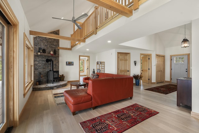 86 City Point Rd, Vinalhaven, ME 04863 - living room featuring high vaulted ceiling, a wood stove, wood finished floors, recessed lighting, and ceiling fan