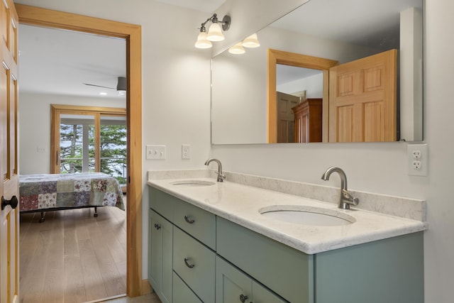 86 City Point Rd, Vinalhaven, ME 04863 - ensuite bathroom with double vanity and wood finished floors