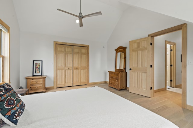 86 City Point Rd, Vinalhaven, ME 04863 - bedroom featuring light wood-type flooring, multiple windows, a closet, high vaulted ceiling, and ceiling fan