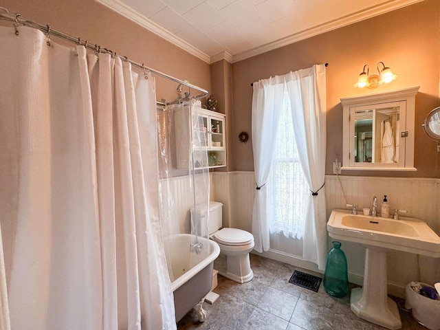81 Parkview Ave, Bangor, ME 04401 - bathroom featuring crown molding, a wainscoted wall, shower / bath combo, and tile patterned floors