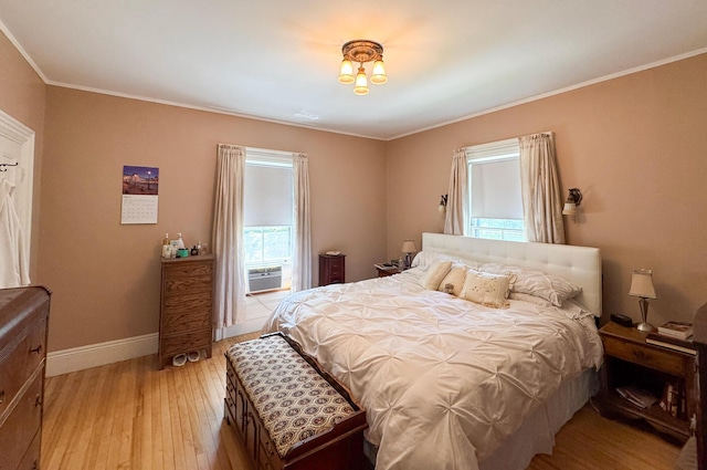 81 Parkview Ave, Bangor, ME 04401 - bedroom with light wood finished floors, ornamental molding, and cooling unit
