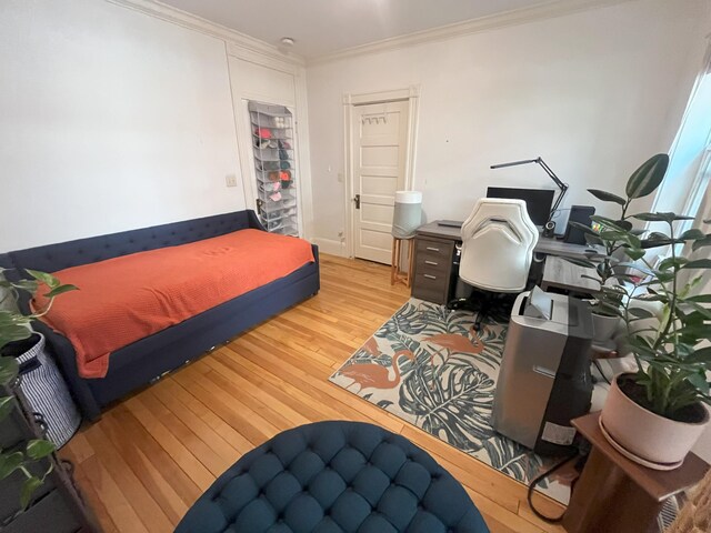 78 Mellen St Unit 2, Portland, ME 04101 - bedroom featuring hardwood / wood-style flooring, ornamental molding, and a desk