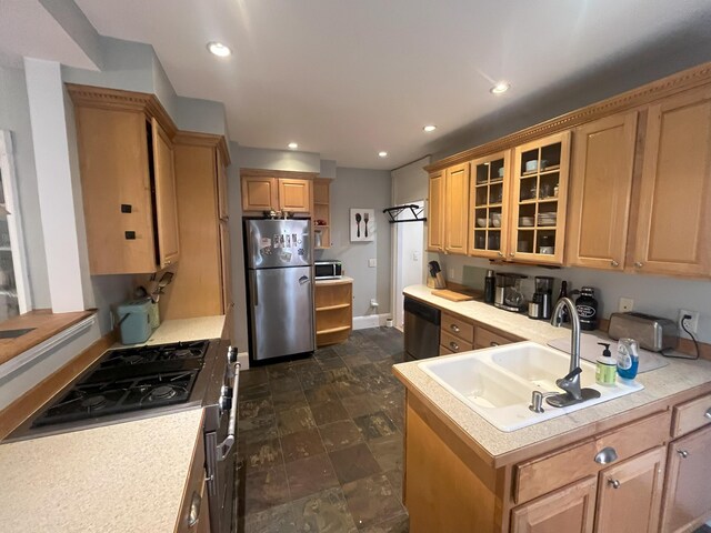 78 Mellen St Unit 2, Portland, ME 04101 - kitchen with appliances with stainless steel finishes, light countertops, open shelves, glass insert cabinets, and recessed lighting