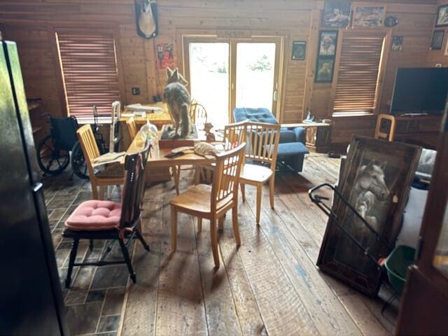 302 Haines Corner Rd, Livermore Falls, ME 04254 - dining area with hardwood / wood-style flooring and wood walls
