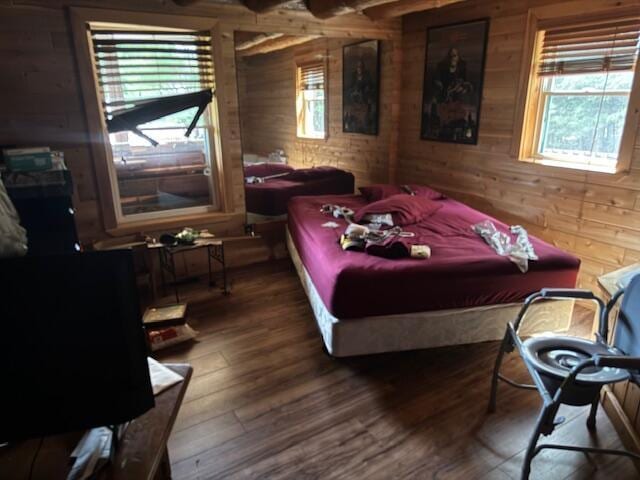 302 Haines Corner Rd, Livermore Falls, ME 04254 - bedroom featuring wooden walls and wood finished floors