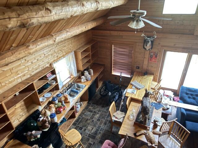 302 Haines Corner Rd, Livermore Falls, ME 04254 - interior space with stone finish floors and wooden walls