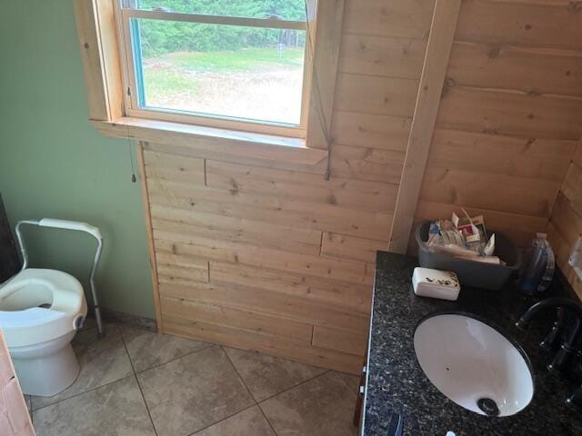 302 Haines Corner Rd, Livermore Falls, ME 04254 - bathroom featuring wooden walls and tile patterned flooring