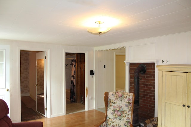 7 Maple St, Milbridge, ME 04658 - sitting room with a wood stove and wood finished floors