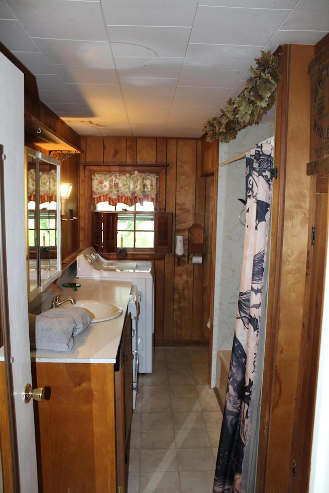 7 Maple St, Milbridge, ME 04658 - kitchen featuring brown cabinets, wooden walls, and light countertops