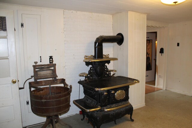 7 Maple St, Milbridge, ME 04658 - detailed view of a wood stove and baseboards