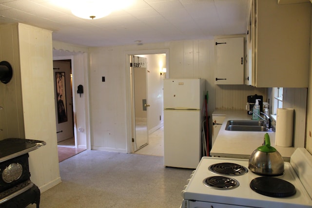 7 Maple St, Milbridge, ME 04658 - kitchen featuring white appliances, light countertops, light floors, and white cabinetry