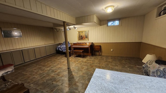 32 Highland Ave, Lincoln, ME 04457 - below grade area featuring wood walls and a wainscoted wall