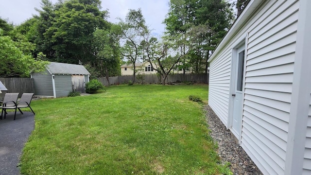32 Highland Ave, Lincoln, ME 04457 - fenced backyard with a storage shed