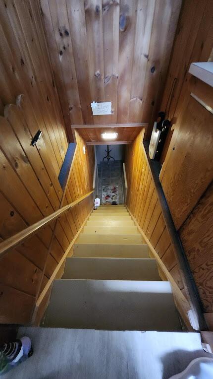 32 Highland Ave, Lincoln, ME 04457 - staircase featuring wood finished floors and wood walls