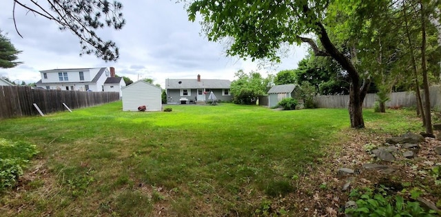 32 Highland Ave, Lincoln, ME 04457 - fenced backyard featuring a shed