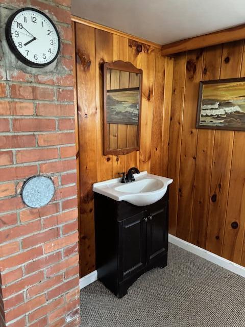13 Frost Hill Ave, Lisbon, ME 04252 - bathroom with vanity and wood walls
