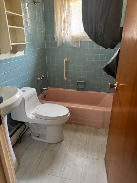 13 Frost Hill Ave, Lisbon, ME 04252 - bathroom with bathtub / shower combination, tile walls, and wood finished floors
