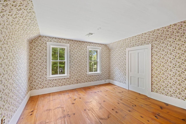 48 Elm St, Newfield, ME 04095 - additional living space featuring hardwood / wood-style floors, wallpapered walls, and lofted ceiling