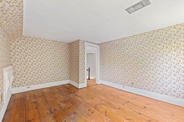 48 Elm St, Newfield, ME 04095 - unfurnished room with wallpapered walls and hardwood / wood-style floors