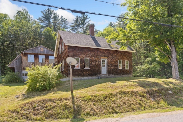 48 Elm St, Newfield, ME 04095 - view of front facade featuring a chimney, a shingled roof, and a front lawn