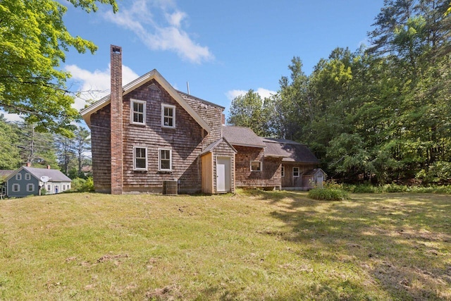48 Elm St, Newfield, ME 04095 - rear view of house featuring a chimney and a yard