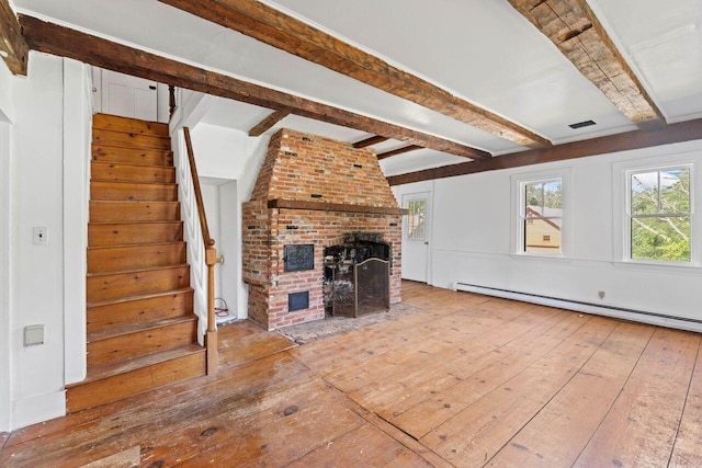 48 Elm St, Newfield, ME 04095 - unfurnished living room with a baseboard radiator, hardwood / wood-style flooring, a brick fireplace, beam ceiling, and stairs
