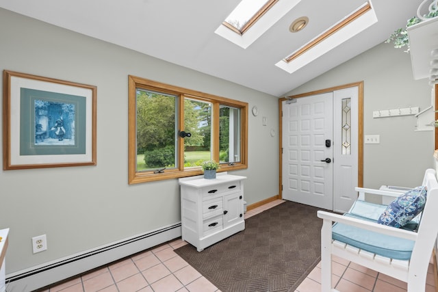 38 Tarr Ave, Lewiston, ME 04240 - entrance foyer featuring baseboard heating, a skylight, vaulted ceiling, and dark tile patterned flooring