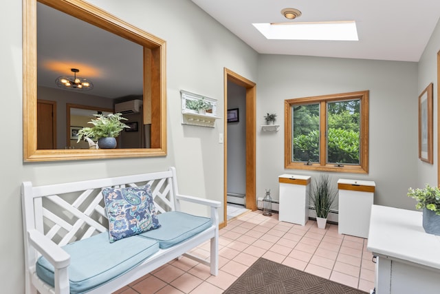 38 Tarr Ave, Lewiston, ME 04240 - corridor with a skylight, vaulted ceiling, baseboard heating, light tile patterned floors, and a wall unit AC