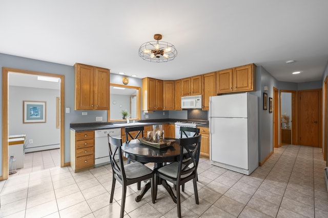 38 Tarr Ave, Lewiston, ME 04240 - kitchen featuring white appliances, baseboard heating, dark countertops, light tile patterned floors, and recessed lighting