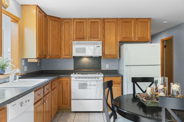 38 Tarr Ave, Lewiston, ME 04240 - kitchen with white appliances, dark countertops, and brown cabinetry