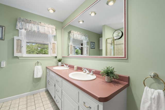 38 Tarr Ave, Lewiston, ME 04240 - bathroom featuring double vanity and tile patterned floors