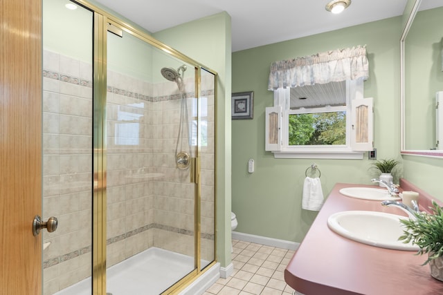 38 Tarr Ave, Lewiston, ME 04240 - full bath featuring tile patterned floors, a stall shower, and double vanity