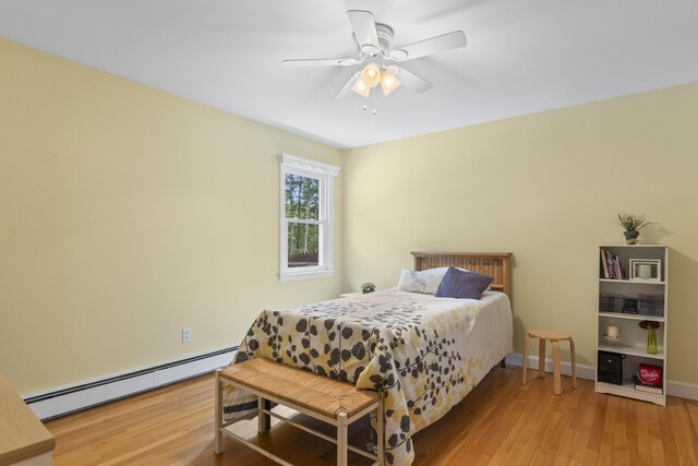38 Tarr Ave, Lewiston, ME 04240 - bedroom with a baseboard heating unit, wood finished floors, and ceiling fan