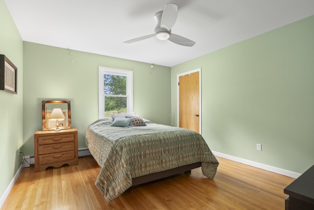 38 Tarr Ave, Lewiston, ME 04240 - bedroom featuring a baseboard heating unit, wood finished floors, and a ceiling fan