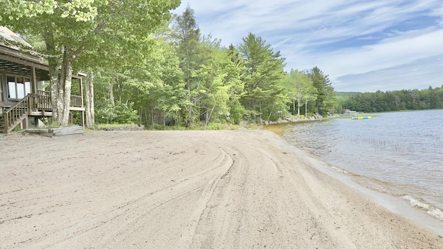 270 Grant Rd, Sullivan, ME 04664 - view of dirt / gravel road with a water view, a forest view, and stairway