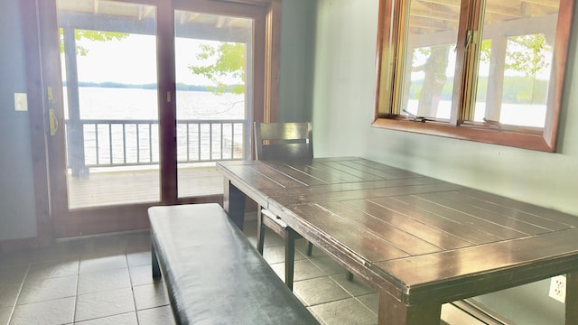 270 Grant Rd, Sullivan, ME 04664 - dining area featuring a water view, tile patterned floors, and healthy amount of natural light