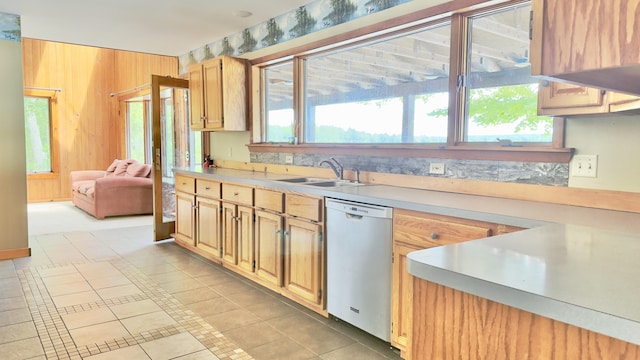 270 Grant Rd, Sullivan, ME 04664 - kitchen with dishwasher, light countertops, plenty of natural light, and wood walls