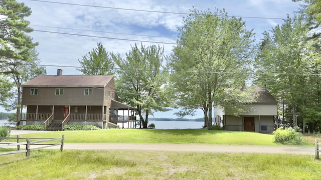 270 Grant Rd, Sullivan, ME 04664 - view of front of property featuring a porch, a chimney, and a water view