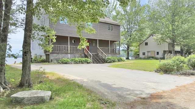 270 Grant Rd, Sullivan, ME 04664 - view of front facade with covered porch and a front yard