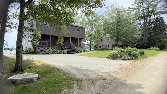 270 Grant Rd, Sullivan, ME 04664 - view of front of property featuring a porch, a front yard, and driveway