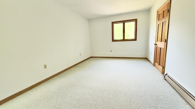 270 Grant Rd, Sullivan, ME 04664 - unfurnished bedroom with a baseboard radiator and light carpet