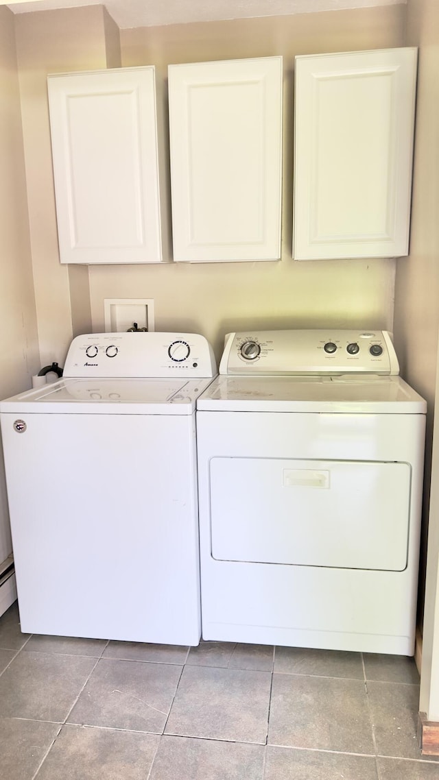270 Grant Rd, Sullivan, ME 04664 - washroom with cabinet space, washer and dryer, and tile patterned floors