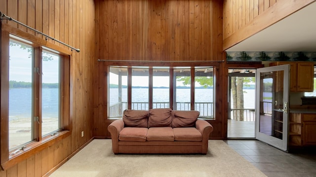 270 Grant Rd, Sullivan, ME 04664 - living area featuring a water view, wood walls, and tile patterned flooring