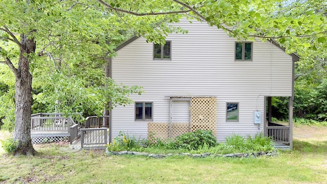 270 Grant Rd, Sullivan, ME 04664 - view of side of property with a wooden deck and a lawn
