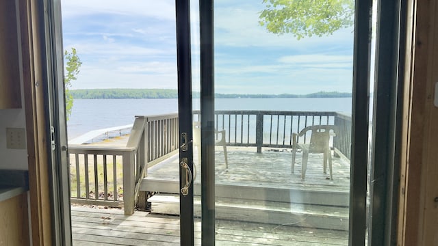 270 Grant Rd, Sullivan, ME 04664 - doorway with a water view, healthy amount of natural light, and wood finished floors