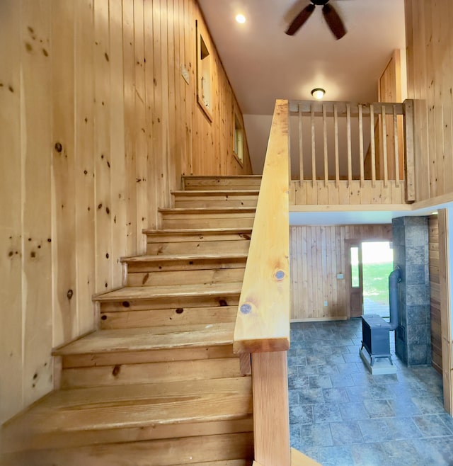 270 Grant Rd, Sullivan, ME 04664 - staircase with wooden walls, stone finish floors, and ceiling fan