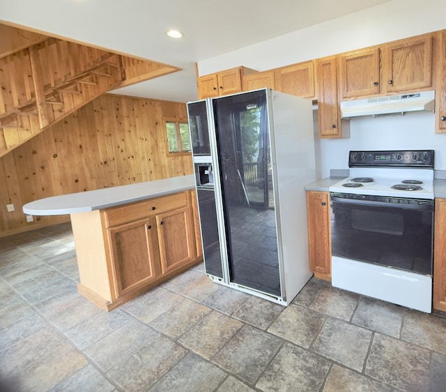 270 Grant Rd, Sullivan, ME 04664 - kitchen featuring white electric range oven, black fridge, under cabinet range hood, wooden walls, and light countertops